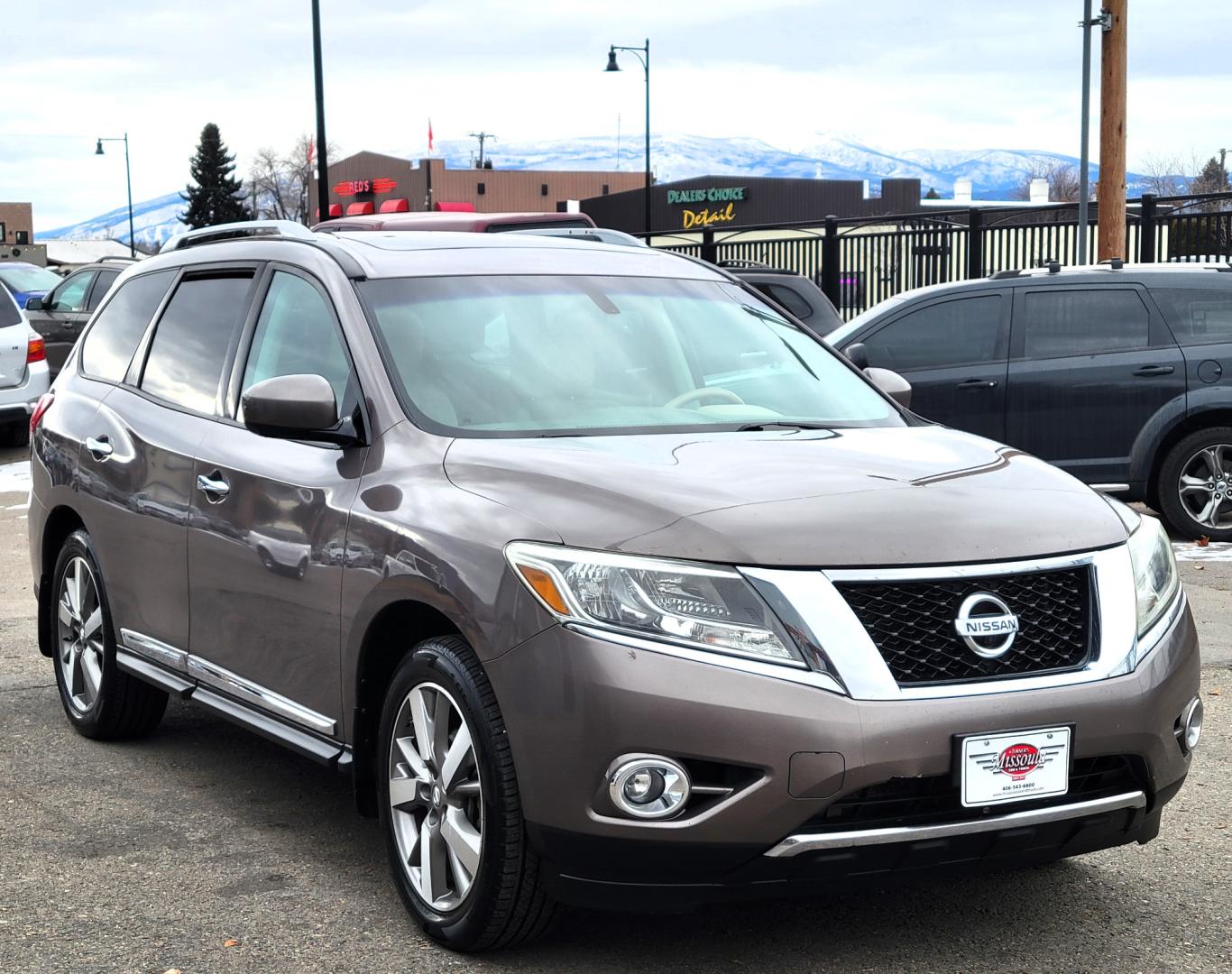 2013 Brown /Tan Nissan Pathfinder Platinum (5N1AR2MM1DC) with an 3.5L V6 engine, Automatic / CVT transmission, located at 450 N Russell, Missoula, MT, 59801, (406) 543-6600, 46.874496, -114.017433 - 4 Wheel Drive SUV. Power Sunroof. 3rd Row Seating. Heated Leather Front and Middle Seats. Power Front Seats. DVD Screens in Headrests. Navigation. Bluetooth. Backup Camera. AM FM CD DVD XM. Heated Steering Wheel. Towing. - Photo#4